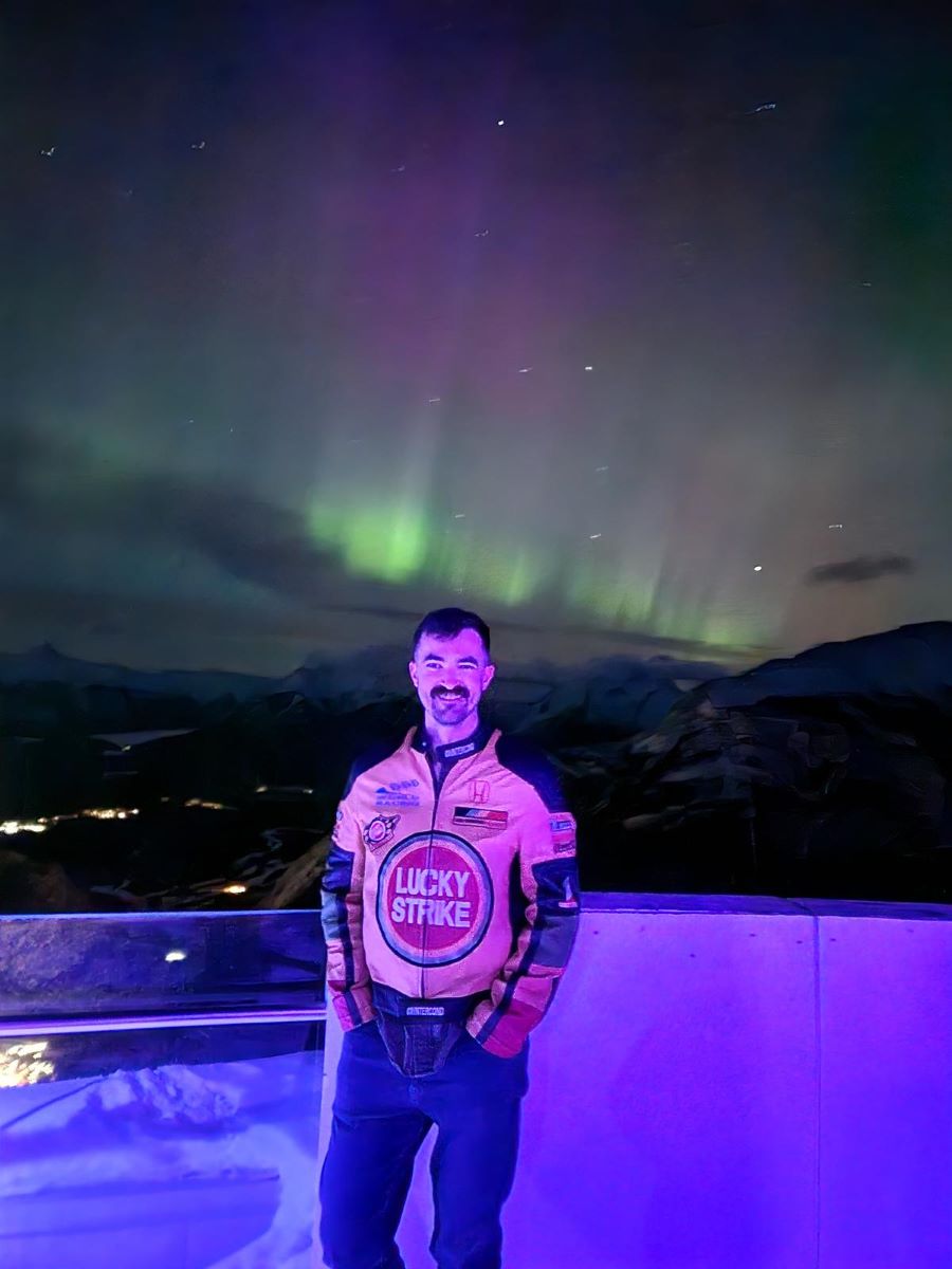 Ross standing in front the Northern Lights