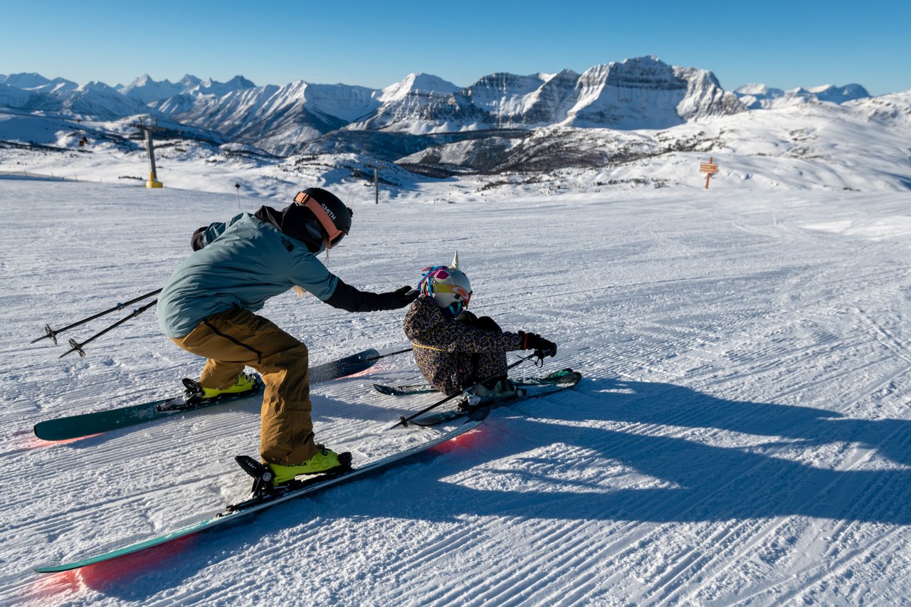 Family Skiing at Banff Sunshine Village by Reuben Krabbe