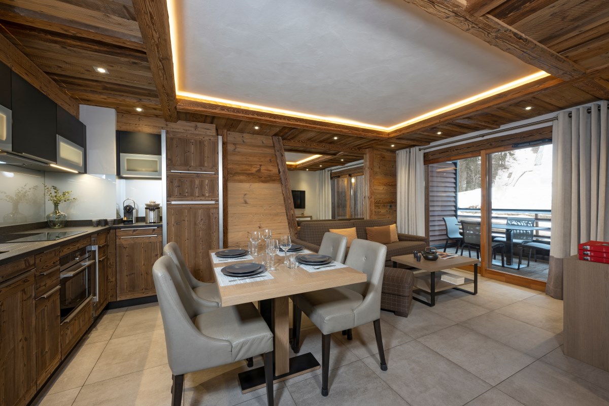 Residence Le Cristal de Jade Chamonix - bright living room dining room and kitchen with private balcony and mountain views