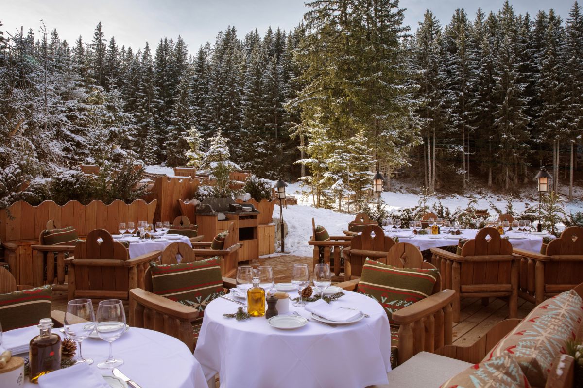 Hotel Fouquet's Courchevel - Alfresco dining terrace with snowy forest views