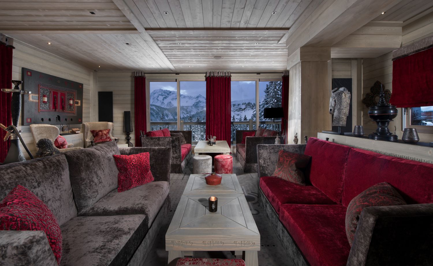 Hotel Le K2 Altitude Courchevel - communal seating ara with large sofas and windows with mountain views