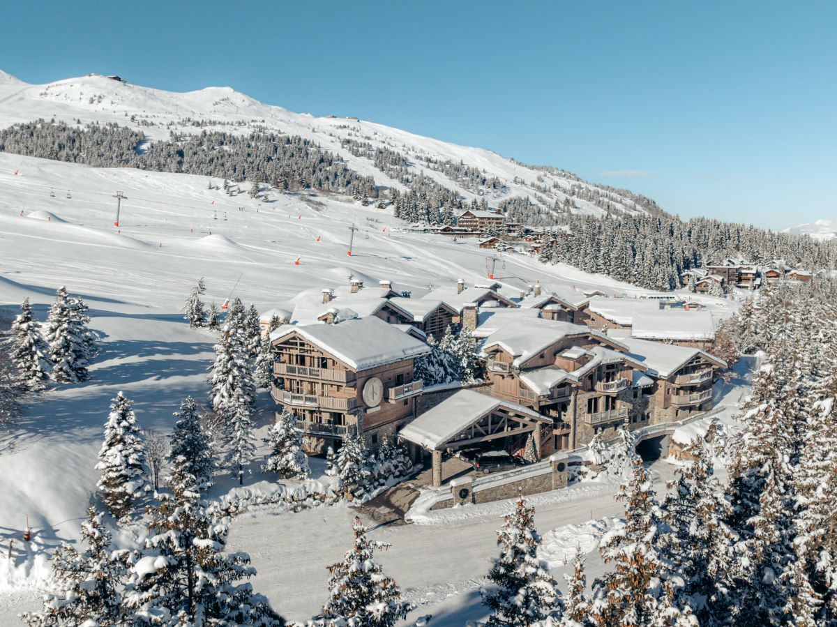 Hotel Le K2 Altitude Courchevel - hotel exterior with slopes snow and mountains
