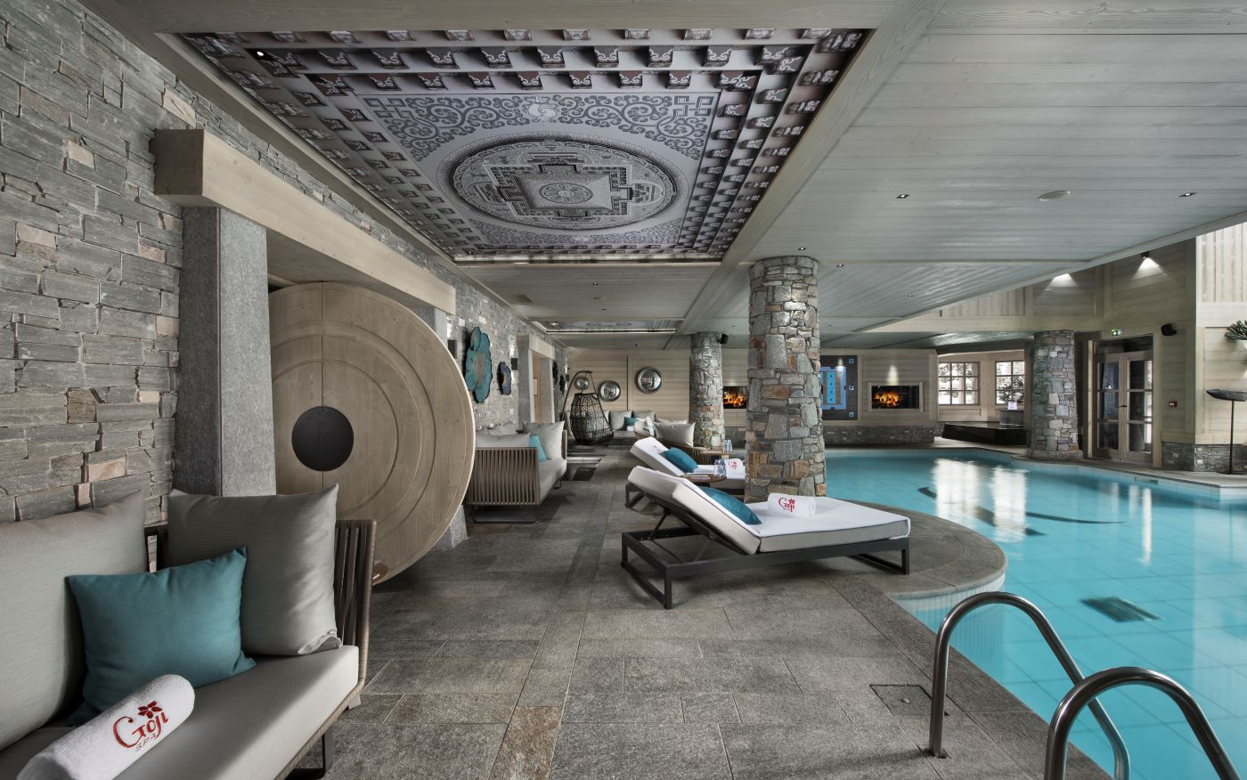 Hotel Le K2 Altitude Courchevel - indoor swimming pool with loungers sofas and egg chair