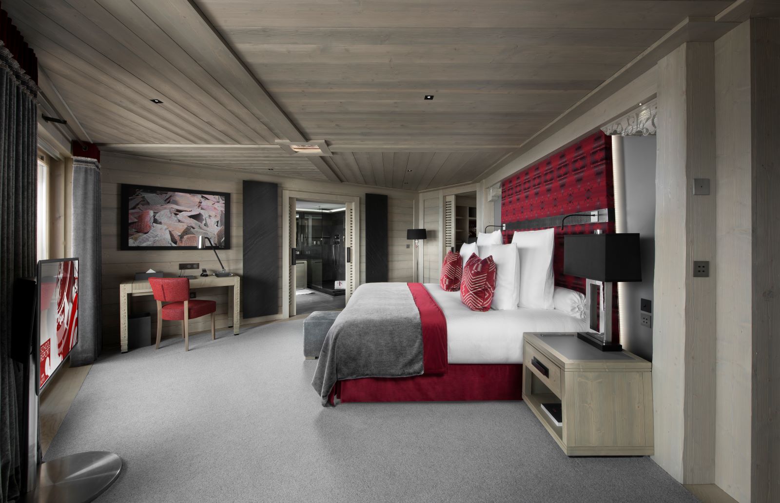 Hotel Le K2 Altitude Courchevel - spacious king size bedroom with tv writing desk walk in wardrobe and ensuite