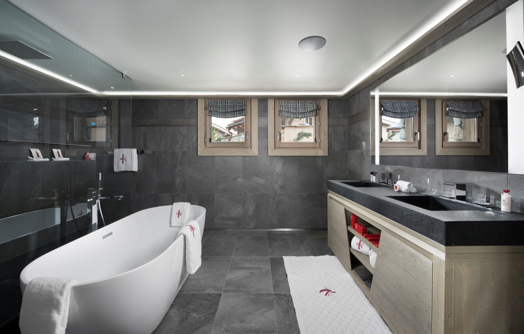 Hotel Le K2 Altitude Courchevel - luxurious bathrrom with free standing bath double sink and large mirror