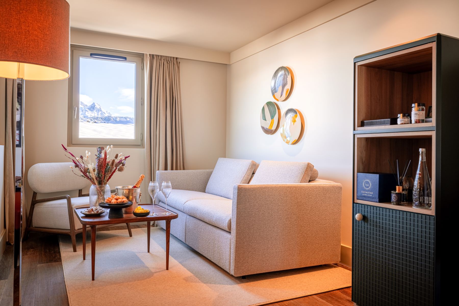 Les Suites de la Potinière Courchevel - Cosy sitting room with small sofa and chair coffee table and mountain views