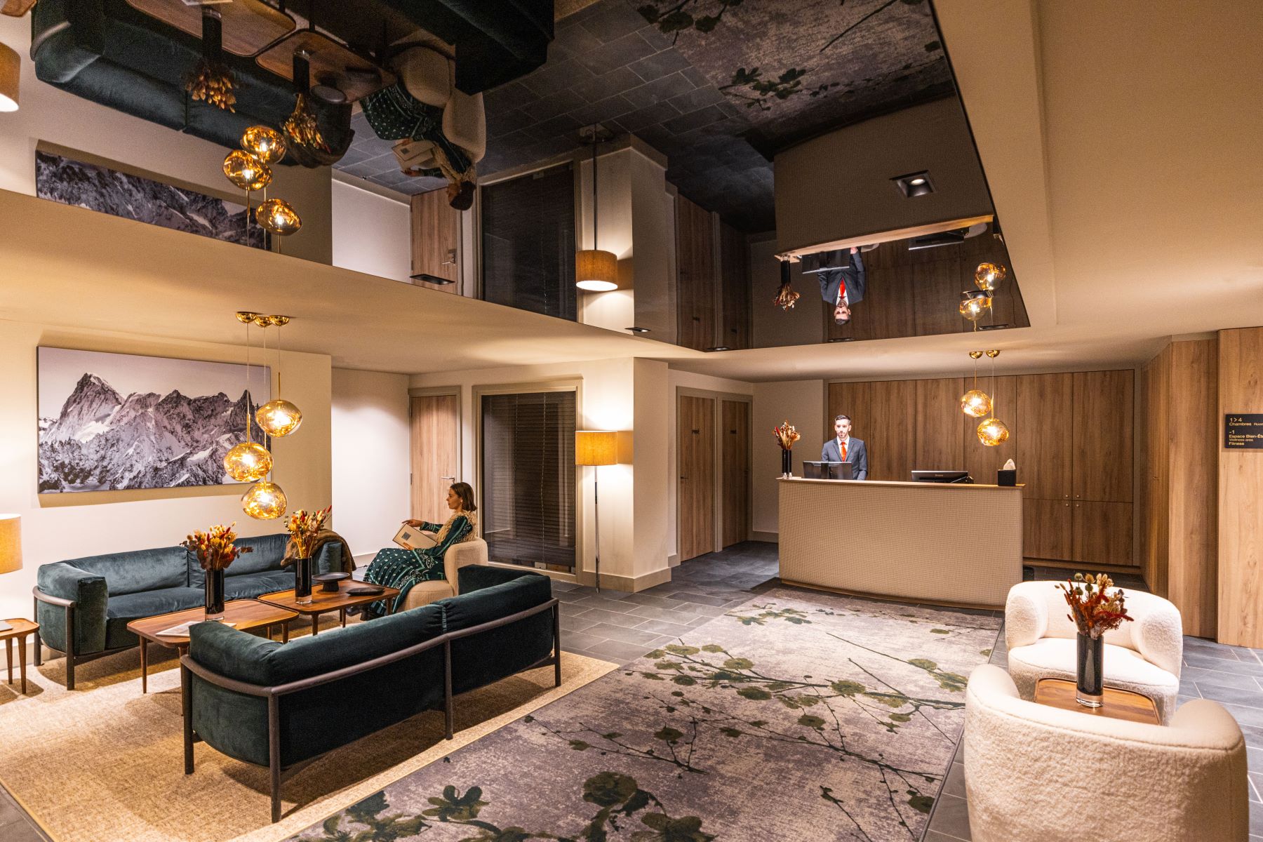 Les Suites de la Potinière Courchevel - hotel lobby with comfy seating areas and reception desk